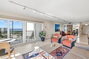 A spacious living area with a balcony, a dining area, and a kitchen. - Long Boat Key Vacation Home (Longboat Key)