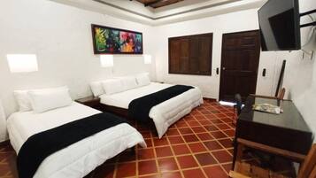 Classic Triple Room | Down comforters, in-room safe, individually decorated, desk