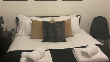 1 bedroom, desk, iron/ironing board, travel crib