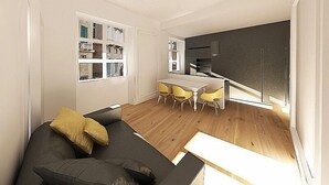 Un salon moderne avec un canapé et un coin repas doté de chaises jaunes.