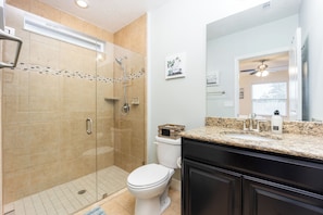 Shower, hair dryer, towels, toilet paper