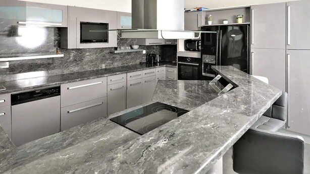 A modern kitchen with a granite countertop, stainless steel appliances, and a built-in oven. - Amazing home in La Chapelle-Vendômoise (La Chapelle-Vendômoise)