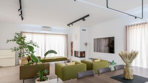 A modern living room with a sofa set, a dining table, and a fireplace. - Pet friendly home in Skrip (Skrip)