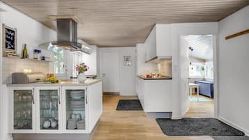 Fridge, stovetop, dishwasher, coffee/tea maker
