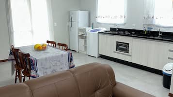 Family Quadruple Room | Living area | 32-inch Smart TV with digital channels, TV
