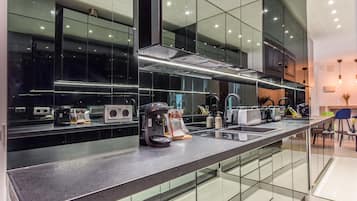 Fridge, microwave, stovetop, coffee/tea maker
