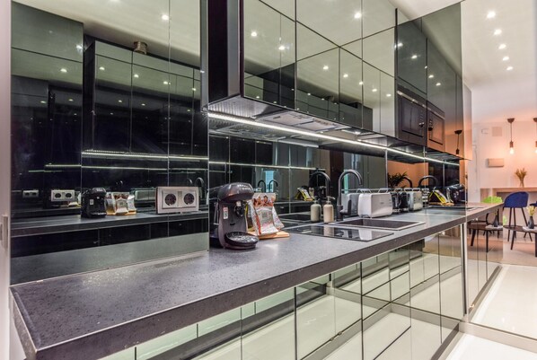 Fridge, microwave, stovetop, coffee/tea maker