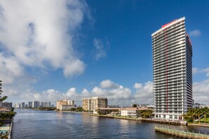 Enjoy expansive city and waterway views from the hotel's sleek, curved balconies.
