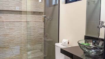 Shower, designer toiletries, hair dryer, towels