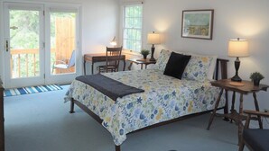 A bedroom with a bed, two bedside tables with lamps, a chair, a desk, and a window. - Latitude Adjustment II - SIMPLY GORGEOUS WITH GREAT LOCATION CLOSE TO DOWNTOWN! (Frankfort)