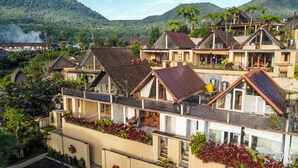 A residential area with multiple two-story houses, some with balconies and a variety of roof styles. - Bedugul Lake View Villa (Buleleng)