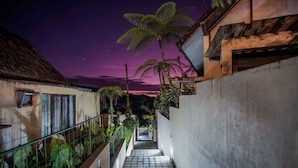 A nighttime view of a staircase leading to a building with a starry sky above. - Bedugul Lake View Villa (Buleleng)