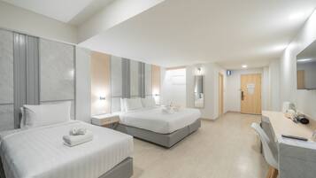 Deluxe Triple Room | Minibar, individually furnished, desk, laptop workspace