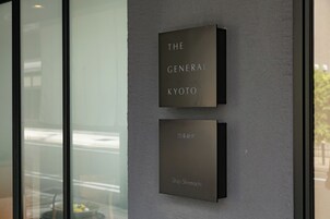 Two plaques on a wall with text.