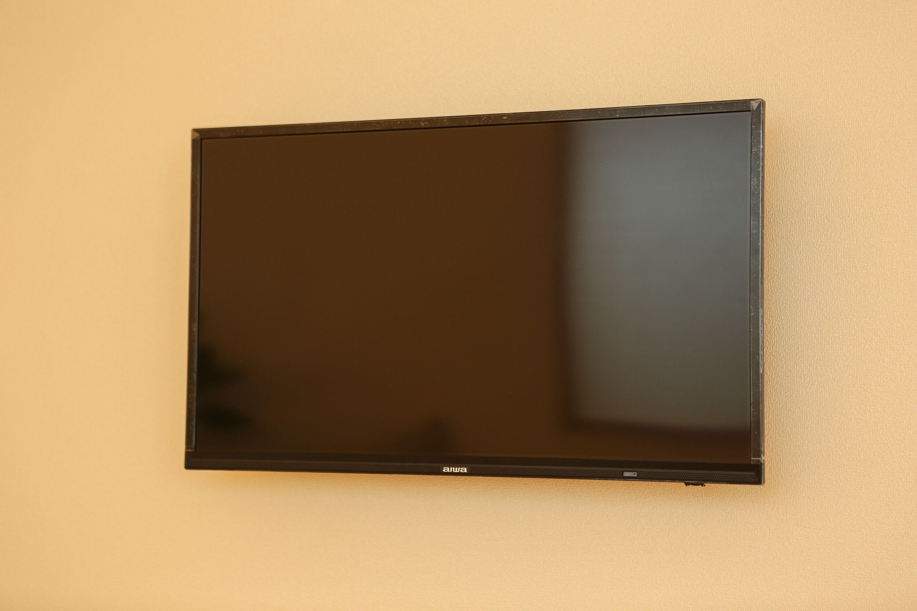 A flat-screen TV mounted on a wall.