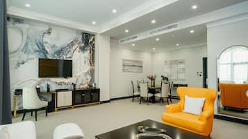 Executive Suite | Living area | 42-inch LCD TV with digital channels, TV, heated floors