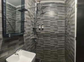 Shower, rainfall showerhead, slippers, towels