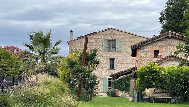 A stone house with a well-maintained garden, including various plants and a lawn. - Mas Des Fleurs - Heated pool - Child friendly gardens - Beach 10mins   (Perpignan)