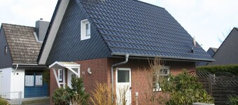 Vacation home in a quiet location close to the beach with a small garden