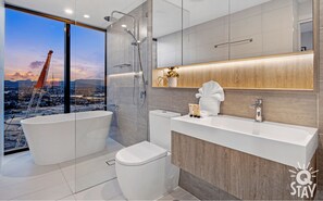 Shower, hair dryer, towels, soap