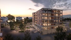 A multi-story residential building with balconies, a central courtyard, and surrounding greenery. - bsmart hotel Arbon (Arbon)