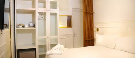 Down comforters, free minibar, individually furnished, desk