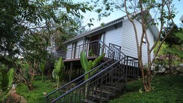 Deluxe Quadruple Room, 2 Queen Beds | Courtyard view
