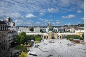 A cityscape with a large open square, historic buildings, and a prominent church. - HNG Hotel Nancy Gare (Nancy)