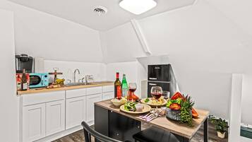 Fridge, microwave, stovetop, coffee/tea maker