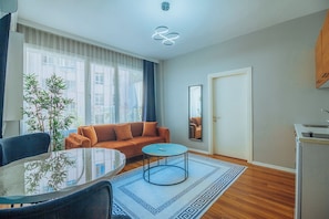 Executive Apartment | Living area | 43-inch Smart TV with satellite channels - Wonder Suites (Istanbul)