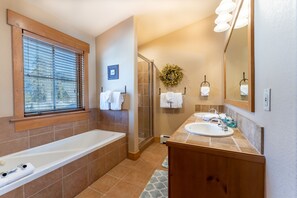 Combined shower/tub, hair dryer, towels, soap