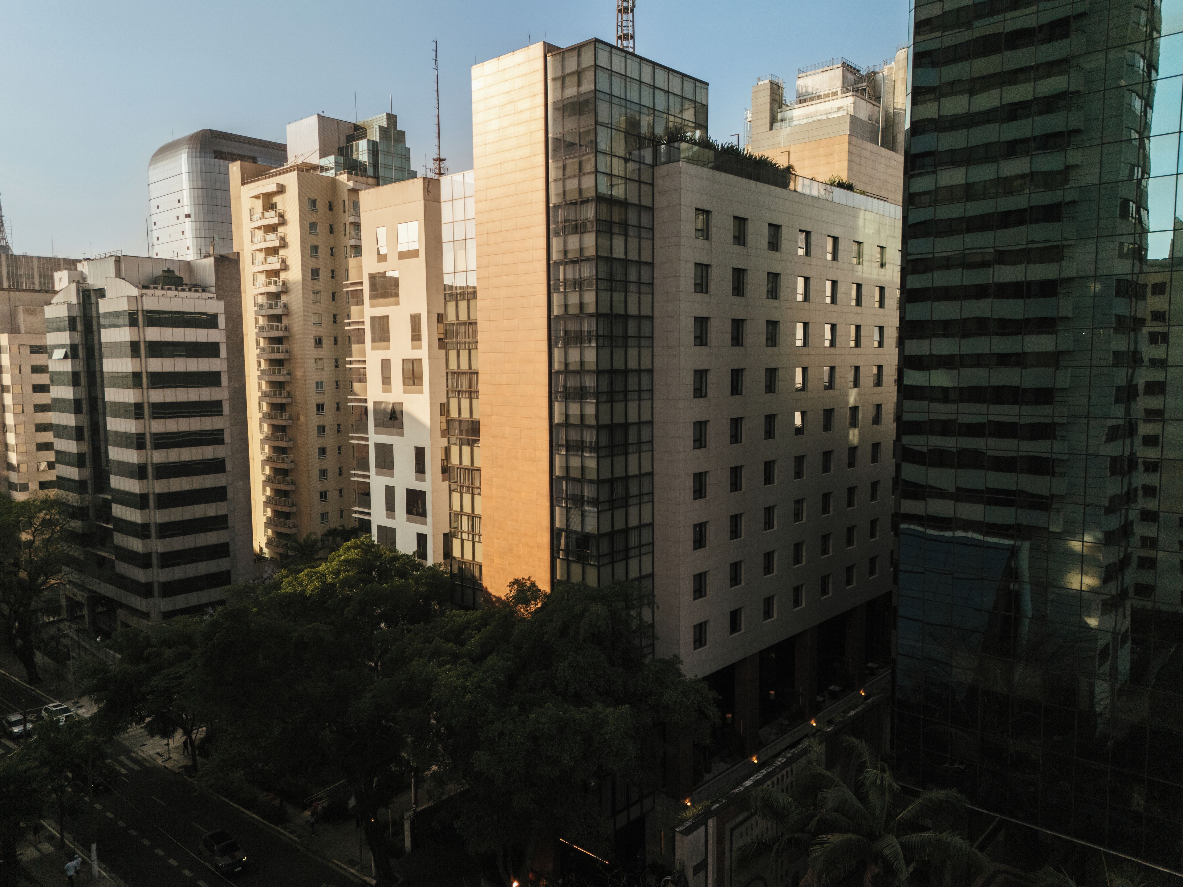 A high-rise building with multiple floors, large windows, and a modern architectural design.