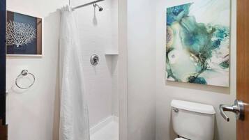 Shower, hair dryer, towels, shampoo