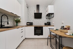 Apartment, 1 Bedroom, Balcony | Private kitchen | Microwave, dishwasher, coffee/tea maker, cookware/dishes/utensils - Wrocław Nowa Manufaktura Apartments (Wroclaw)