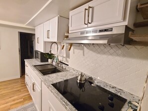 Fridge, microwave, stovetop, coffee/tea maker