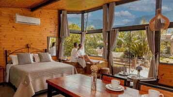 Honeymoon Chalet, Jetted Tub, Mountain View | Living area | 32-inch Smart TV with cable channels, TV, fireplace