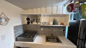 Fridge, stovetop, coffee/tea maker, cookware/dishes/utensils