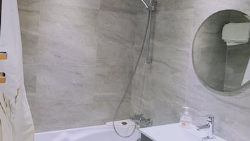 Bathtub, hair dryer, towels