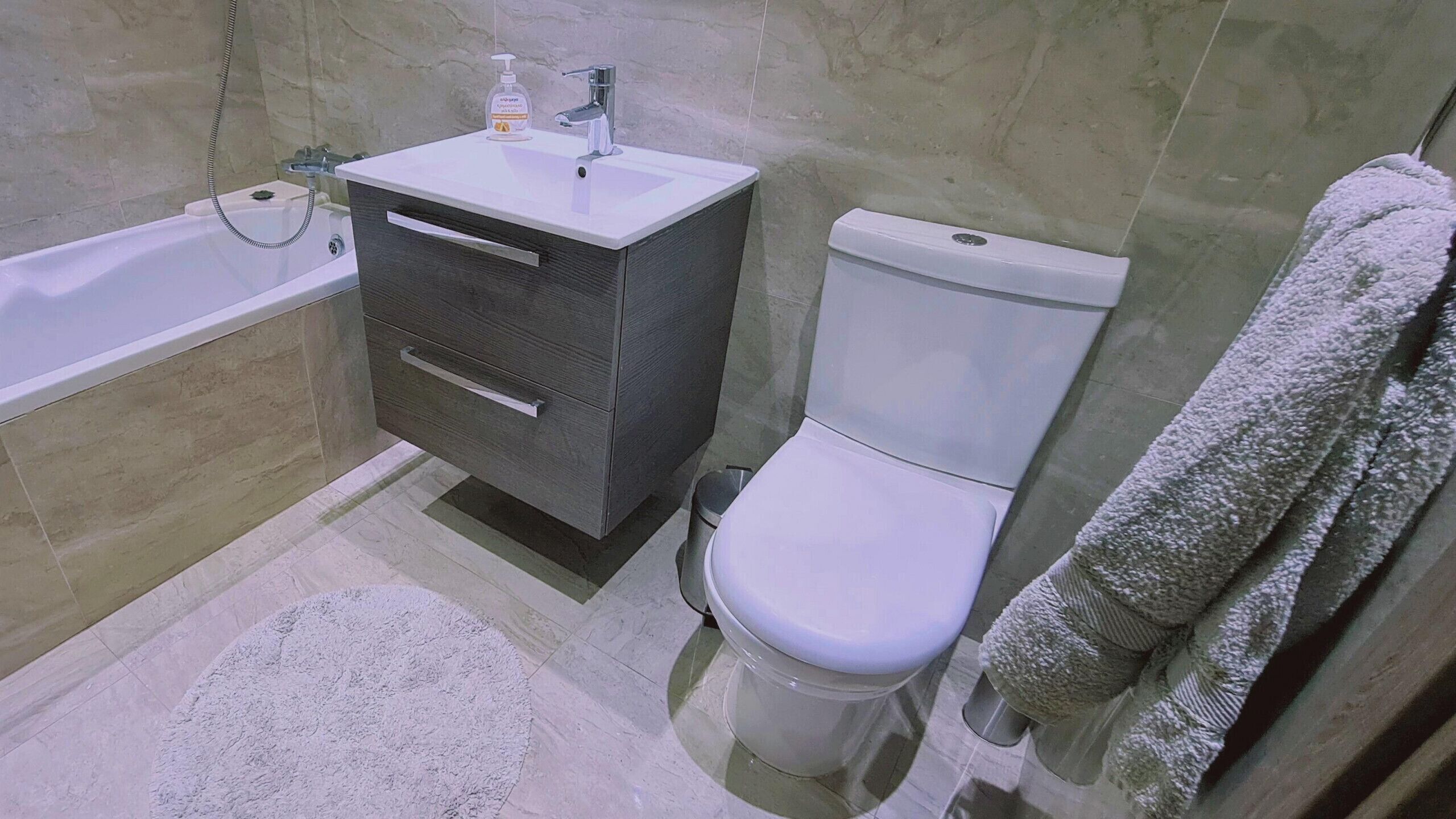 Bathtub, hair dryer, towels