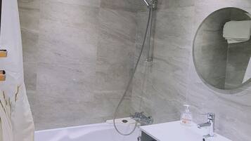 Bathtub, hair dryer, towels
