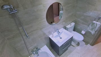 Bathtub, hair dryer, towels