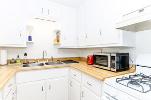 Fridge, microwave, oven, stovetop - Clean & Cozy Apartment w/ Private Patio (Denver)