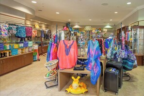 A retail store with various colorful clothing items and accessories on display. - Beautiful 3 bedrooms Condo at Vista Cay with lake view. 
Refurbished July 2024 (Orlando)