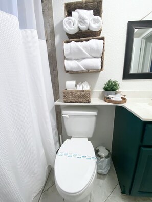 Hair dryer, towels, soap, shampoo