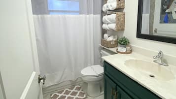 Combined shower/bathtub, hair dryer, towels, soap