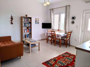 TV, books - Holiday Home "Nora" with 2 Apartments and Shared Pool - Sea Breeze 1 (Agios Spiridon)