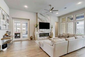 TV, fireplace, books, offices