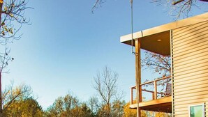A modern cabin with a deck overlooking a lake, surrounded by trees. - Villa 1 · Waterfront Villa, spacious with 2 balcony and beds (Athens)