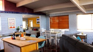 A compact living space with a kitchenette, a dining area, and a seating area with a sofa and chairs. - Welcome to The Gem-Best Location in Uptown Sedona (Sedona)
