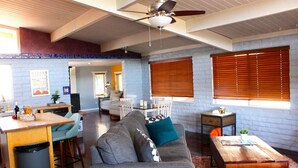 A spacious living area with a gray sofa, wooden coffee table, and a ceiling fan. - Welcome to The Gem-Best Location in Uptown Sedona (Sedona)